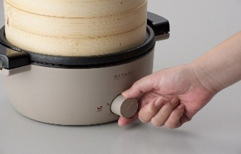 せいろをセットし本製品のつまみを回す図